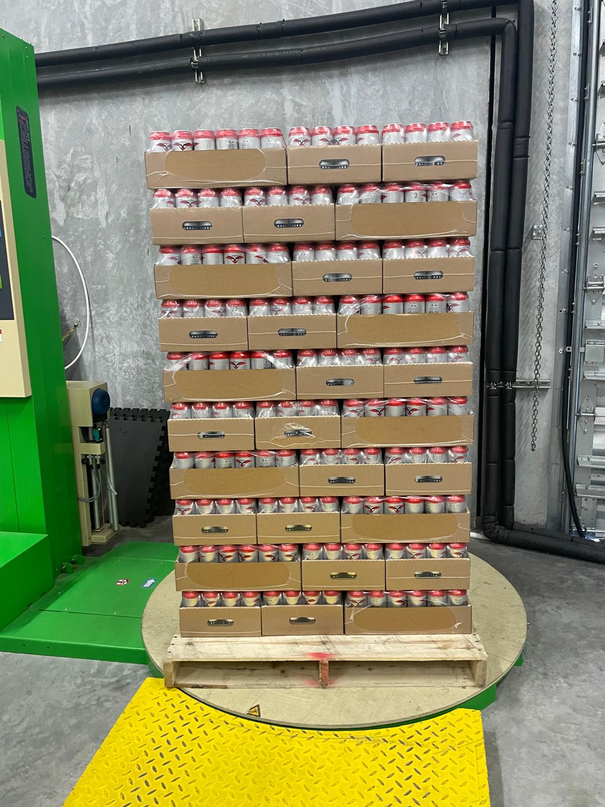 We Can It palletized branded canned water ready to ship from the Miami production center